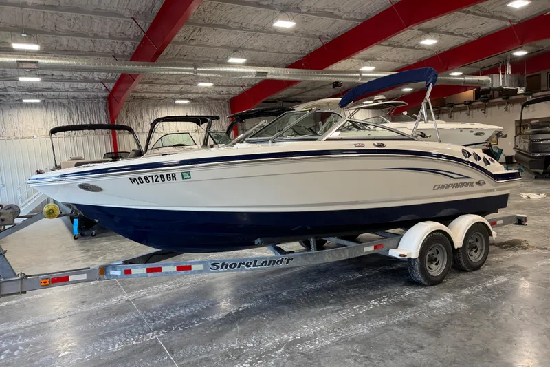 Slide: The Image of 2012 Chaparral 216 SSi boat on ShoreLand'r trailer in indoor storage facility. - 10