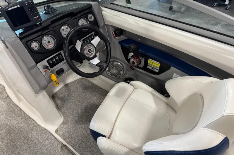 Slide: The Image of 2012 Chaparral 216 SSi boat cockpit with steering wheel and instrument panel. - 16
