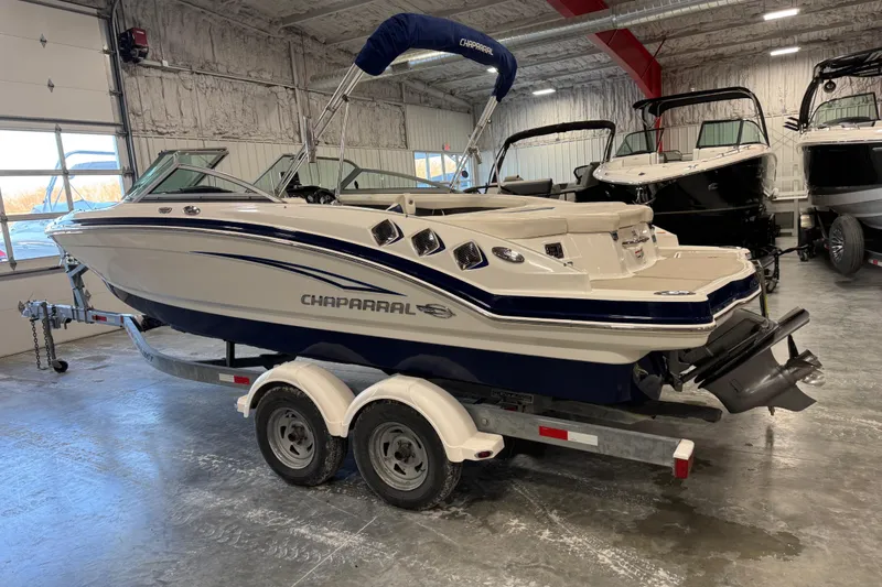 Slide: The Image of 2012 Chaparral 216 SSi boat on trailer in indoor showroom. - 3