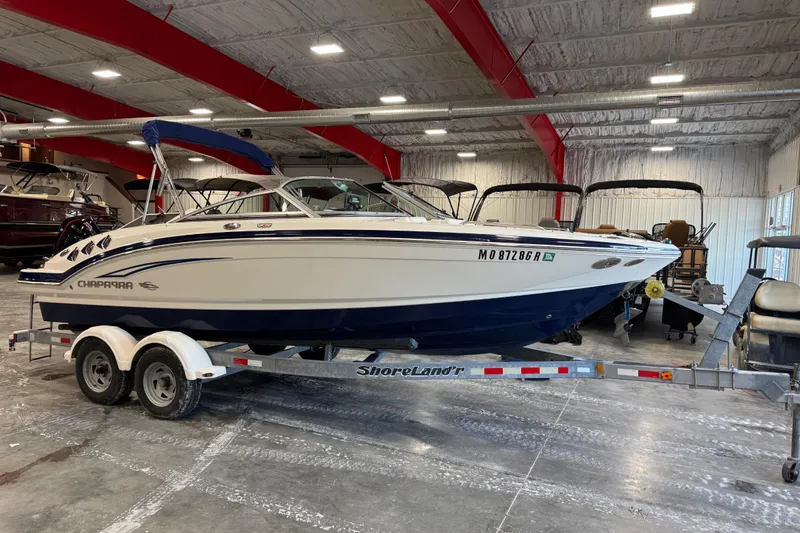 Slide: The Image of 2012 Chaparral 216 SSi boat on ShoreLand'r trailer in indoor storage facility. - 9