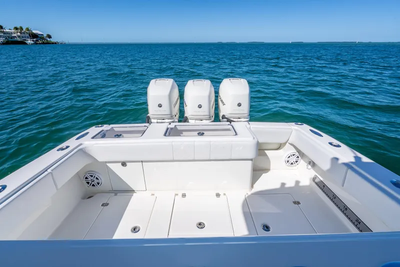 Slide: The Image of 2019 SeaVee 340Z boat with triple engines on open ocean. - 18