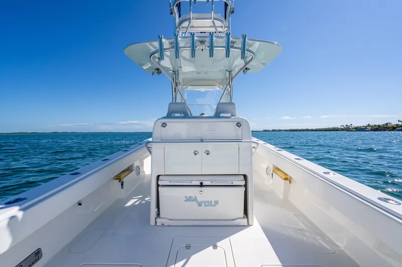 Slide: The Image of 2019 SeaVee 340Z boat on open water, clear sky, and sleek design. - 19