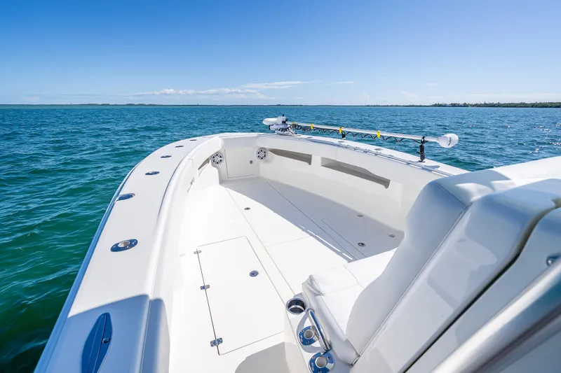 Slide: The Image of 2019 SeaVee 340Z boat on open water, showcasing spacious deck and seating. - 25