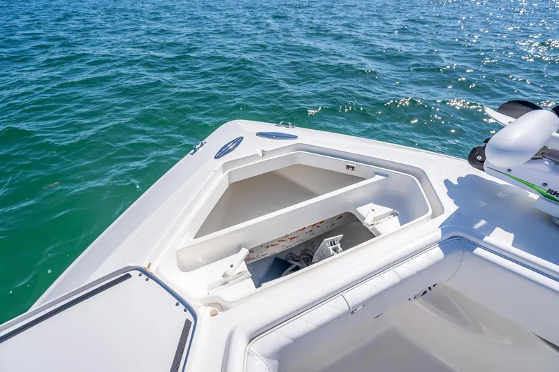 Slide: The Image of 2019 SeaVee 340Z boat anchor compartment with open hatch on calm water. - 30