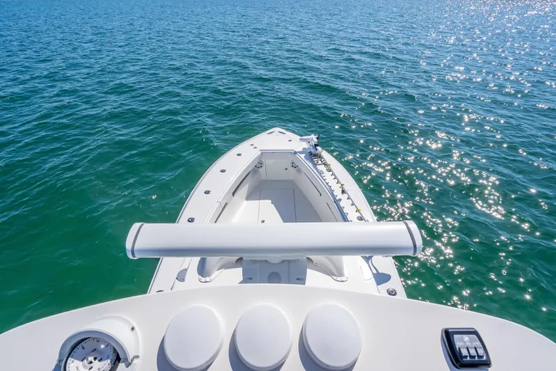 Slide: The Image of 2019 SeaVee 340Z boat on sparkling blue water, showcasing bow and deck features. - 34
