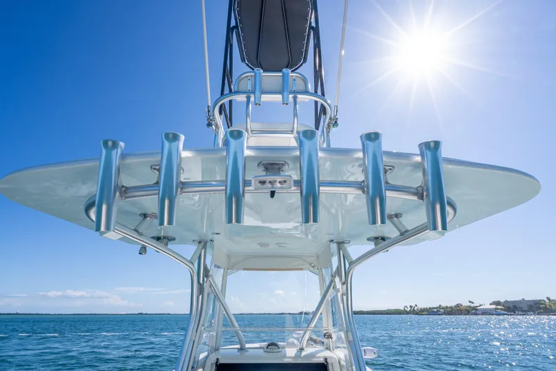 Slide: The Image of 2019 SeaVee 340Z boat with rod holders under sunny blue sky. - 37