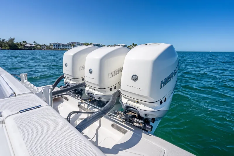 Slide: The Image of 2019 SeaVee 340Z boat with triple Mercury outboard engines on open water. - 39