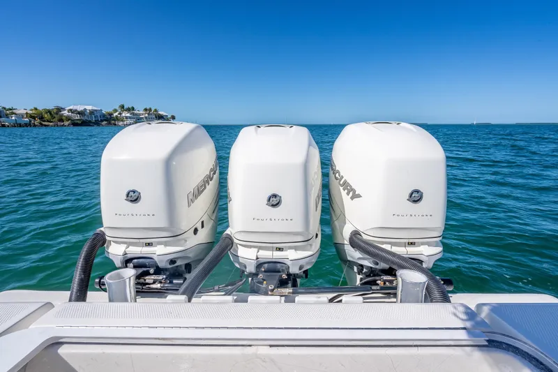 Slide: The Image of Triple Mercury outboard engines on a 2019 SeaVee 340Z boat in open water. - 40