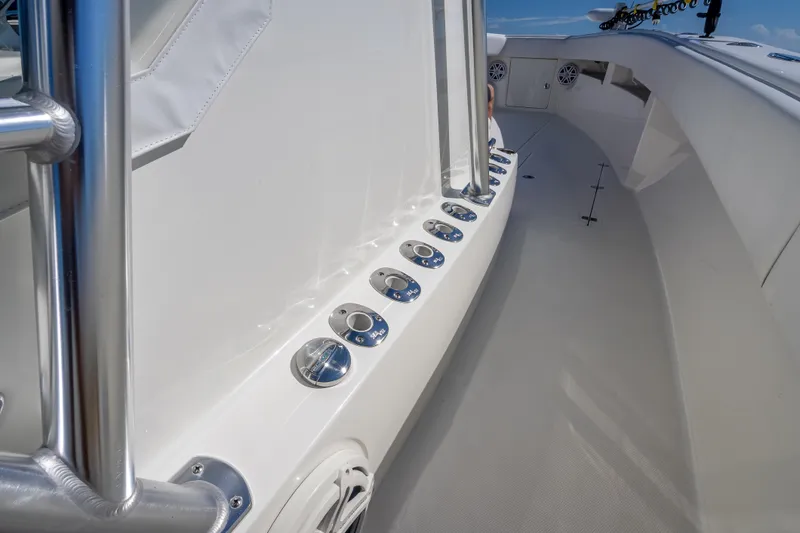 Slide: The Image of 2019 SeaVee 340Z boat deck with rod holders and stainless steel railing. - 41