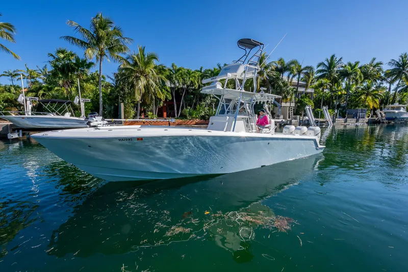 Slide: The Image of 2019 SeaVee 340Z boat on tropical waterway with palm trees in the background. - 7