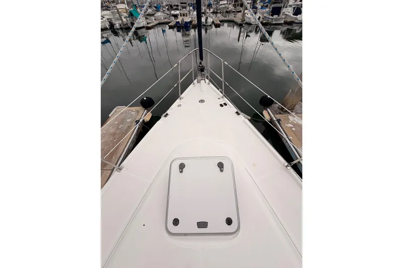 Slide: The Image of Bow view of 2009 Hunter 38 sailboat docked in marina. - 10