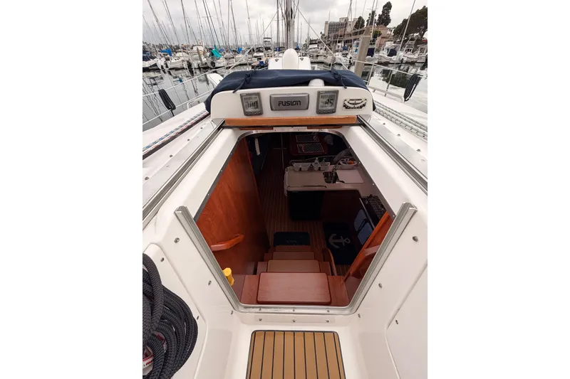 Slide: The Image of Interior view of 2009 Hunter 38 sailboat cabin entrance at marina. - 18