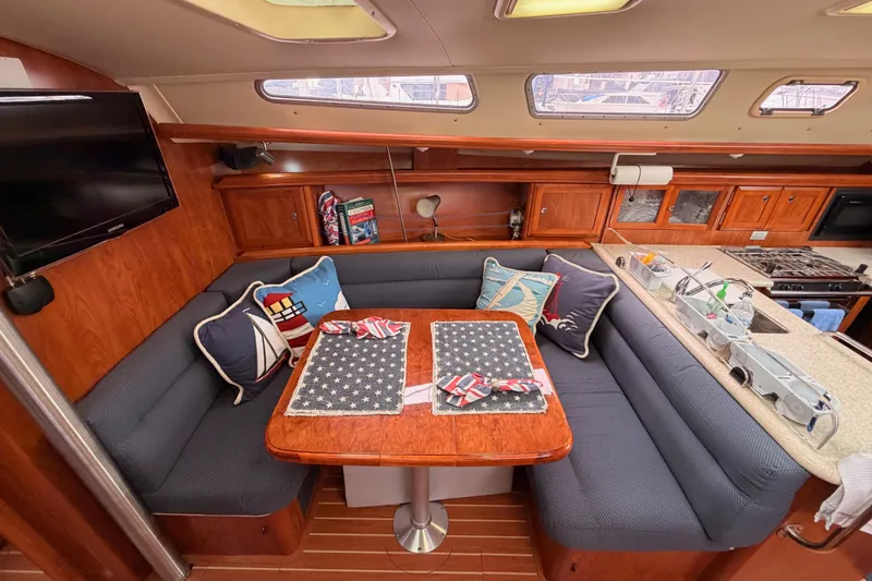 Slide: The Image of Cozy interior of 2009 Hunter 38 sailboat with dining area and kitchen. - 36