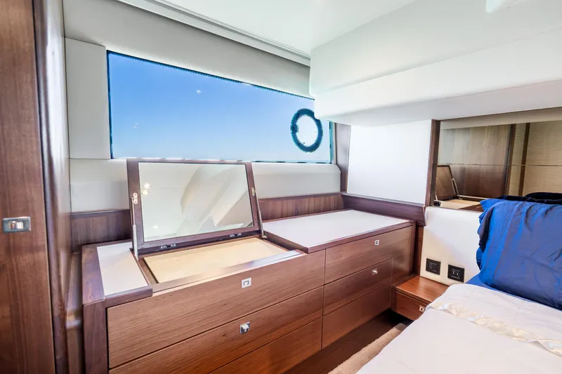 Slide: The Image of Luxurious interior of 2018 Princess F49 yacht with elegant wood finish and vanity mirror. - 33