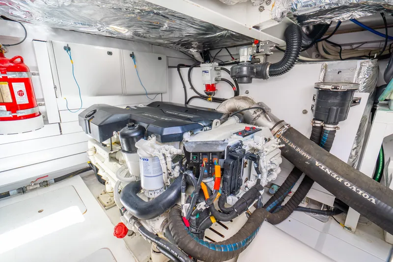 Slide: The Image of Engine room of 2018 Princess F49 yacht with Volvo Penta engine and fire extinguisher. - 58