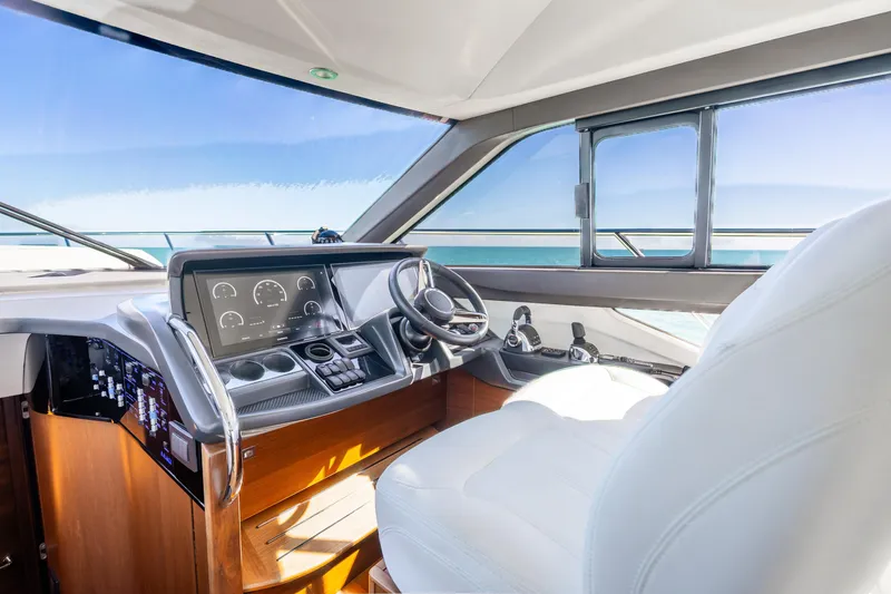 Slide: The Image of Luxurious 2018 Princess F49 yacht helm with modern controls and panoramic sea view. - 20