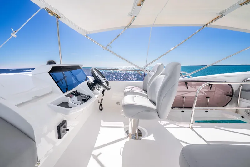 Slide: The Image of Luxurious 2018 Princess F49 yacht helm with ocean view and modern controls. - 55