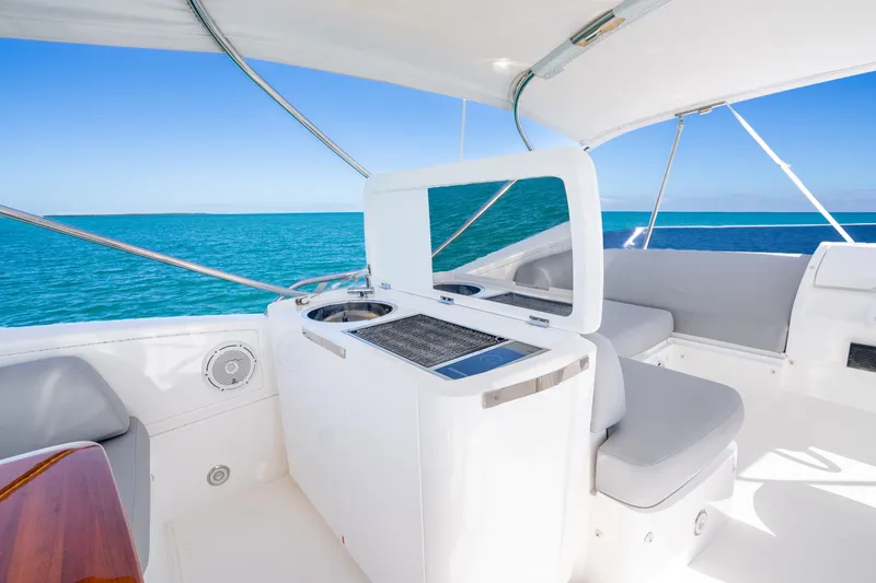 Slide: The Image of Luxurious 2018 Princess F49 yacht interior with ocean view, featuring sleek seating and modern amenities. - 52