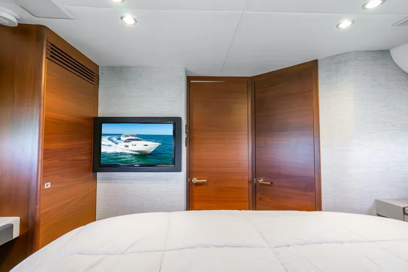 Slide: The Image of Luxurious 2018 Princess F49 yacht interior with wood paneling and wall-mounted TV. - 36