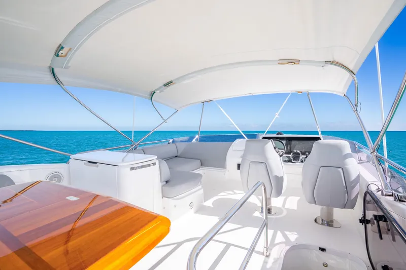 Slide: The Image of Luxurious 2018 Princess F49 yacht interior with ocean view, featuring sleek seating and helm. - 49