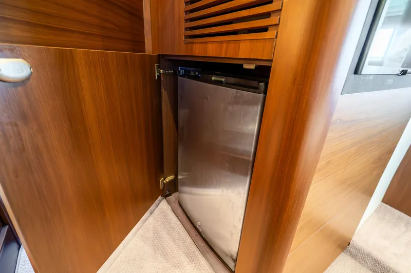 Slide: The Image of Wooden cabinet with built-in fridge on 2018 Princess F49 yacht. - 29