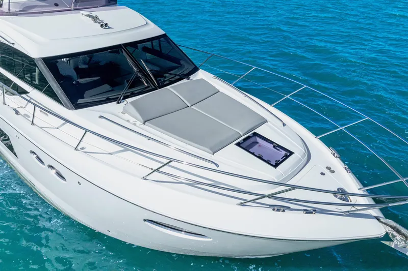 Slide: The Image of 2018 Princess F49 yacht cruising on clear blue water. - 15