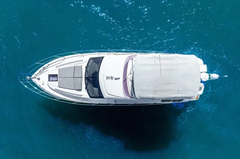 Slide: The Image of Aerial view of 2018 Princess F49 yacht cruising in clear blue waters. - 14