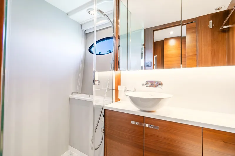Slide: The Image of Luxurious bathroom in 2018 Princess F49 yacht with modern fixtures and wooden cabinetry. - 40
