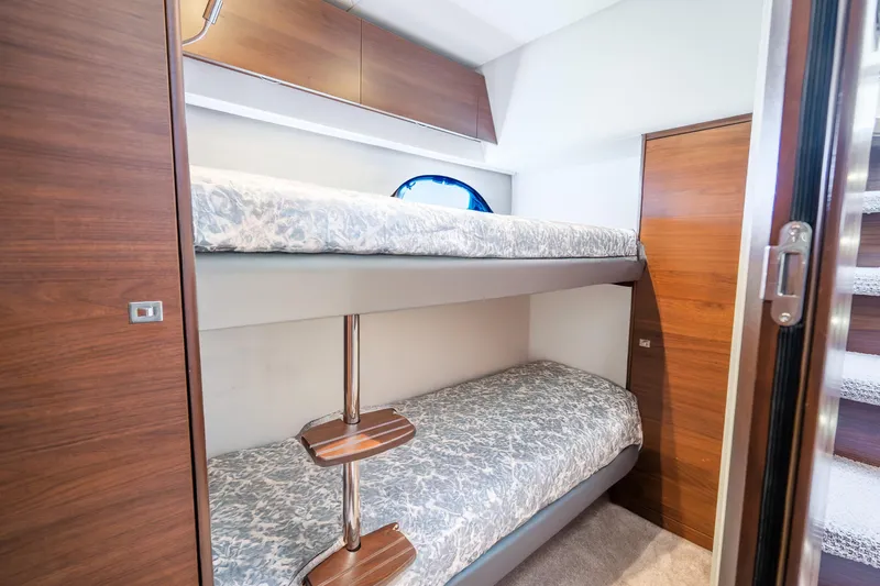 Slide: The Image of Bunk beds in 2018 Princess F49 yacht cabin with wooden accents and modern design. - 41