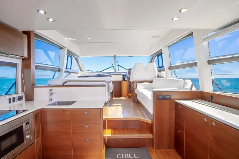 Slide: The Image of Luxurious interior of 2018 Princess F49 yacht with modern wood finishes and ocean views. - 22