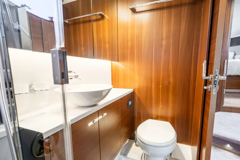 Slide: The Image of Luxurious bathroom in 2018 Princess F49 yacht with wooden cabinetry and modern fixtures. - 34