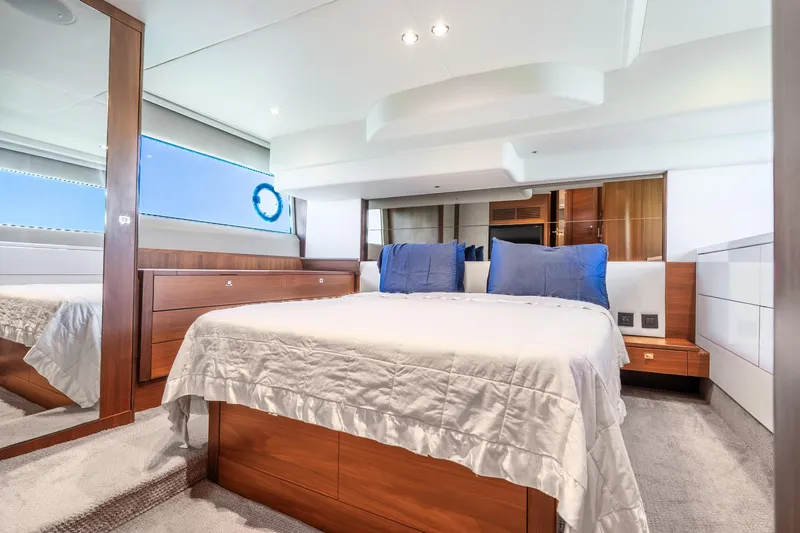 Slide: The Image of Luxurious 2018 Princess F49 yacht bedroom with elegant wood finishes and modern design. - 30