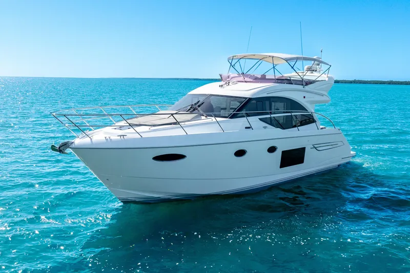 Slide: The Image of 2018 Princess F49 yacht cruising on clear blue ocean waters. - 13