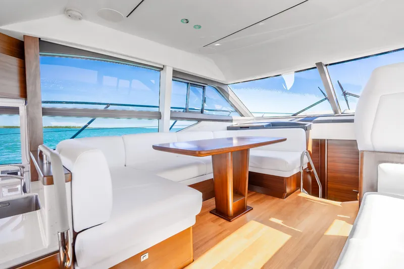 Slide: The Image of Luxurious interior of 2018 Princess F49 yacht with elegant seating and panoramic windows. - 25