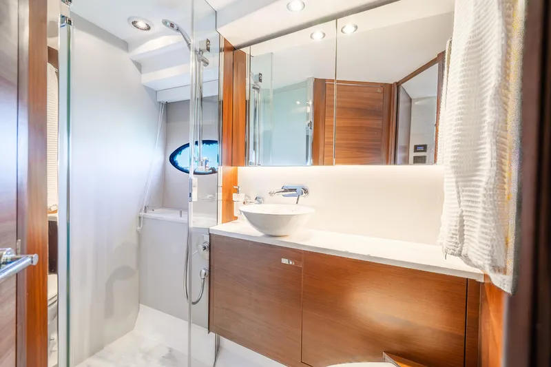 Slide: The Image of Luxurious bathroom in 2018 Princess F49 yacht with modern fixtures and elegant wood accents. - 39