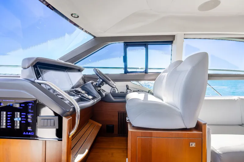 Slide: The Image of Luxurious 2018 Princess F49 yacht interior with modern helm and white seating. - 19