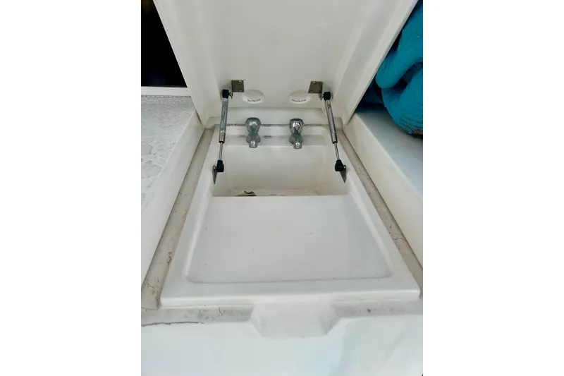 Slide: The Image of Open hatch with faucet on 2005 Bertram 390 Convertible boat. - 10