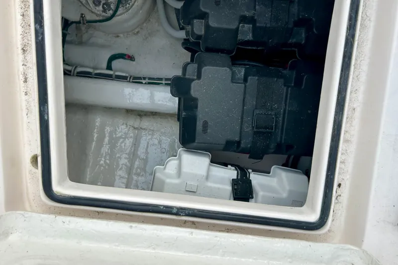 Slide: The Image of Battery compartment of a 2005 Bertram 390 Convertible boat, showing wiring and battery cases. - 12