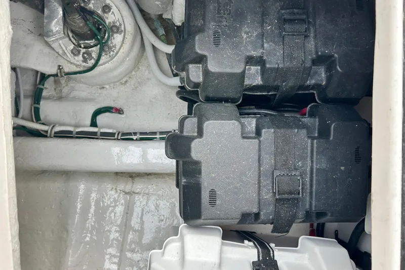 Slide: The Image of Battery compartment of a 2005 Bertram 390 Convertible boat, showing wiring and battery cases. - 13