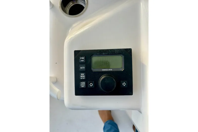 Slide: The Image of Simrad AP26 control panel on 2005 Bertram 390 Convertible yacht dashboard. - 21