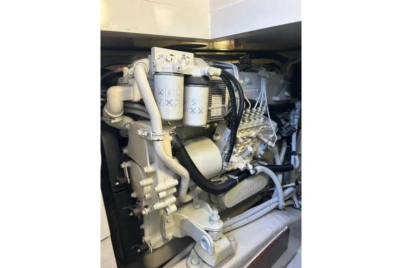 Slide: The Image of Engine of a 2005 Bertram 390 Convertible boat, showcasing intricate mechanical components. - 25