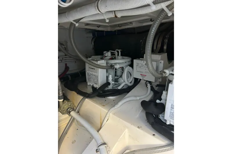 Slide: The Image of Engine room of 2005 Bertram 390 Convertible with visible wiring and equipment. - 30