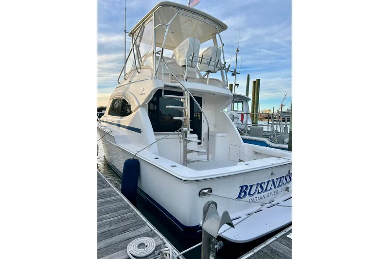 Slide: The Image of 2005 Bertram 390 Convertible yacht docked at marina, rear view. - 7