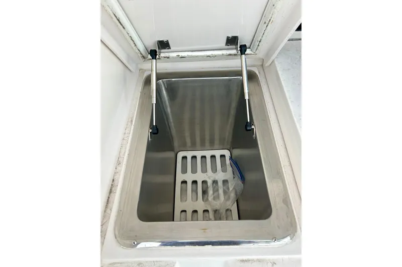 Slide: The Image of Open storage compartment on 2005 Bertram 390 Convertible boat. - 9