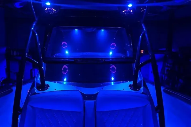 Slide: The Image of 2021 Nor-Tech 390 Sport Center Console with blue LED lighting at night. - 8