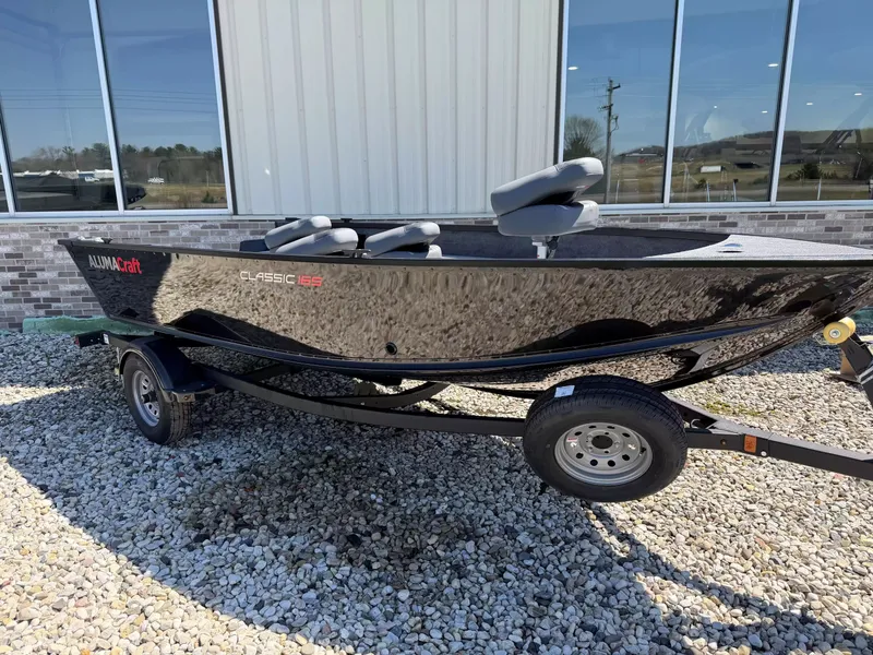Slide: The Image of 2026 Alumacraft CLASSIC 165/TIL boat on trailer, side view. - 3