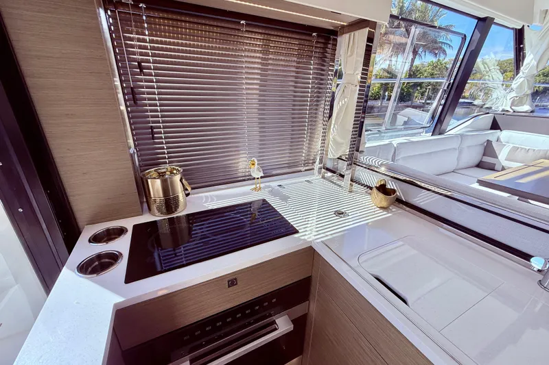 Slide: The Image of Modern kitchen interior of 2024 Jeanneau NC 1295 Fly yacht with sleek design and appliances. - 18