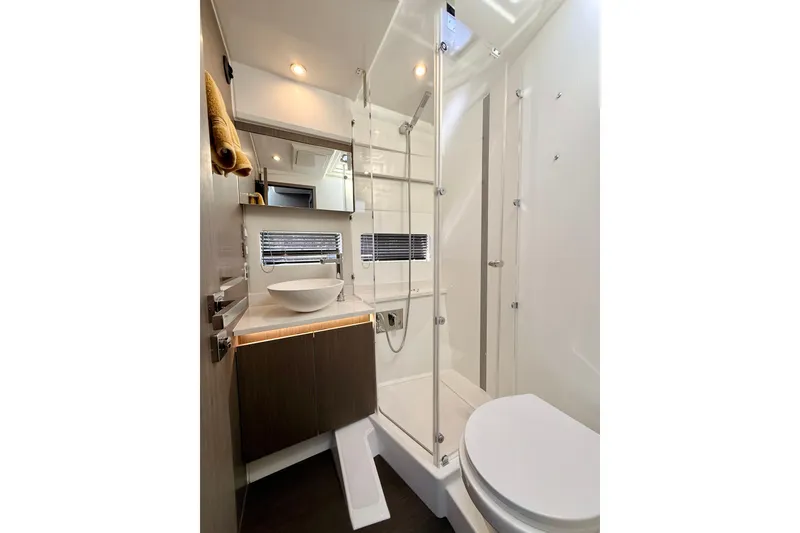 Slide: The Image of Modern bathroom in 2024 Jeanneau NC 1295 Fly yacht, featuring sleek design and glass shower. - 31