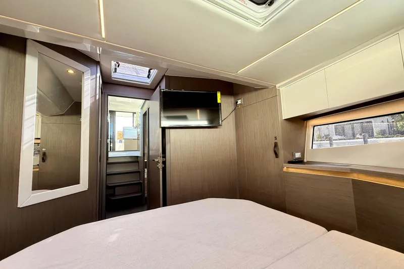 Slide: The Image of 2024 Jeanneau NC 1295 Fly cabin interior with modern design and natural lighting. - 38