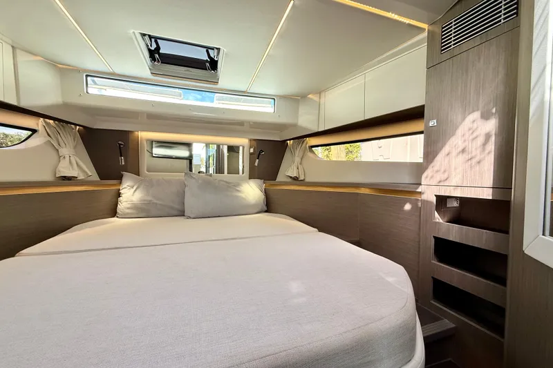 Slide: The Image of Luxurious cabin interior of 2024 Jeanneau NC 1295 Fly yacht, featuring a spacious bed. - 40
